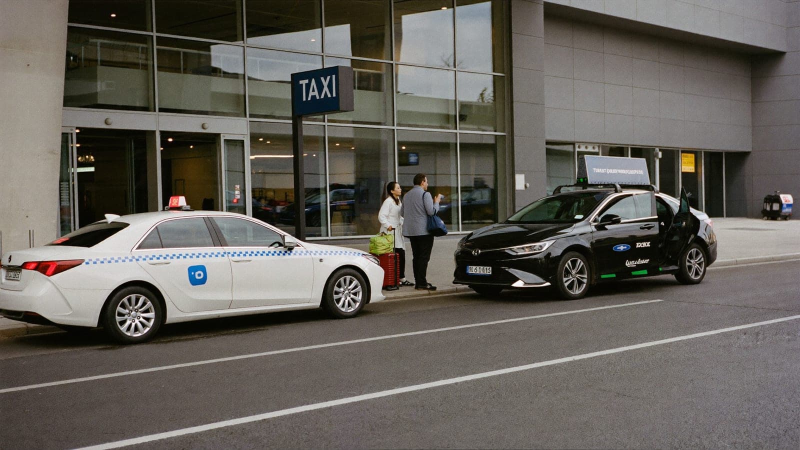 Official Paris taxi and rideshare car waiting at Charles de Gaulle airport pickup area
