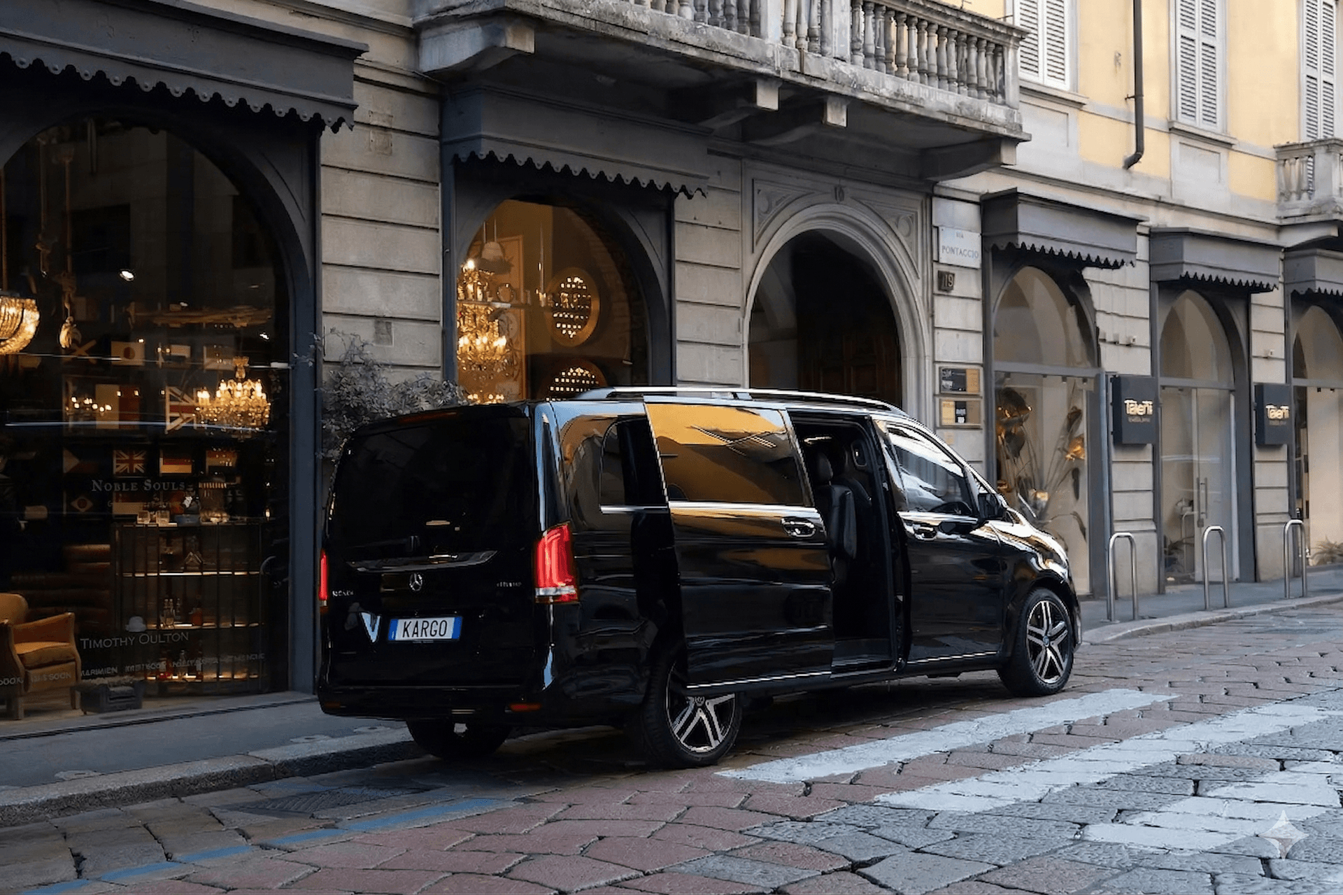 Mercedes V-Class parked in front of luxury hotel