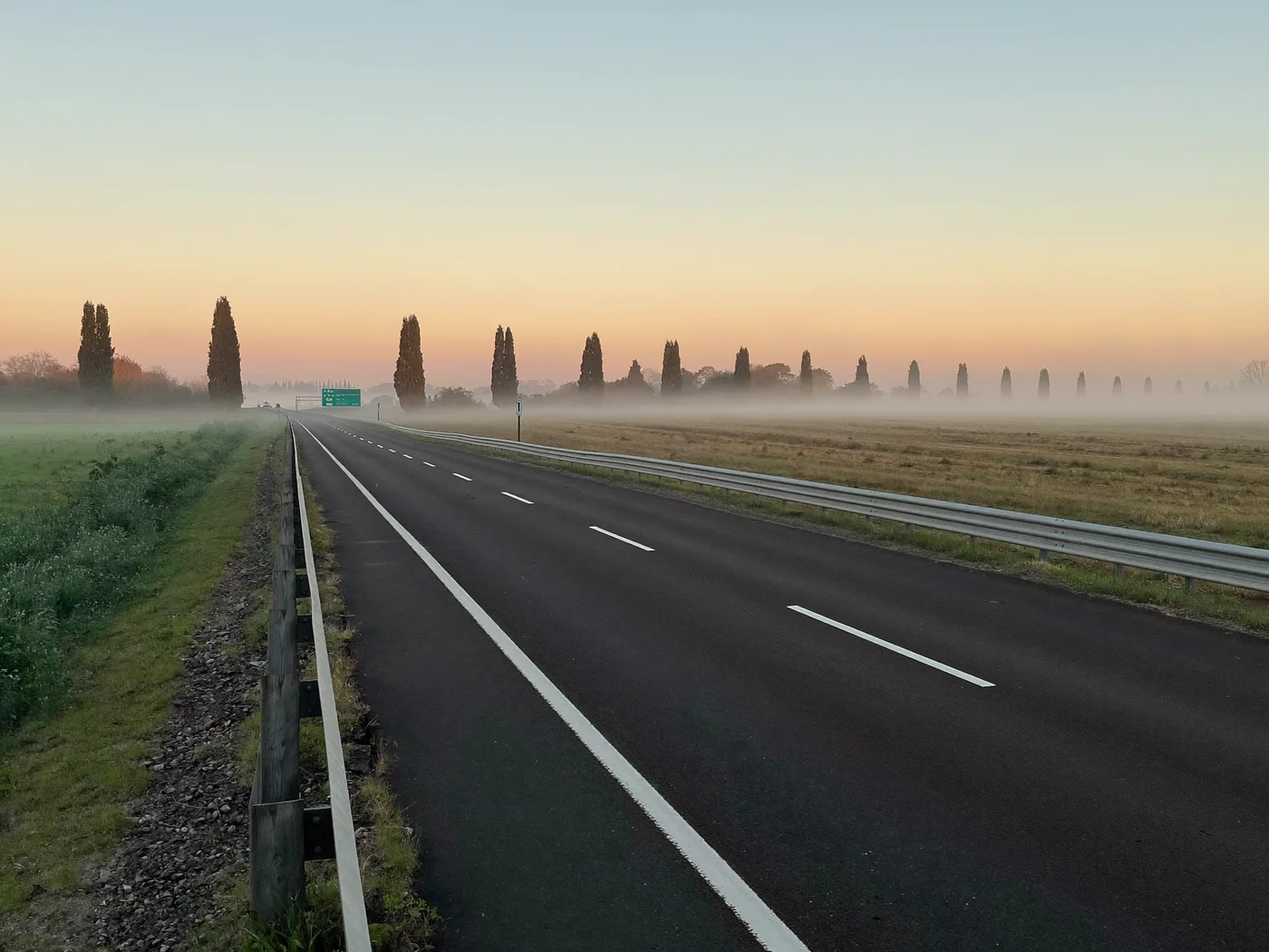 Empty French motorway at dawn in the morning mist